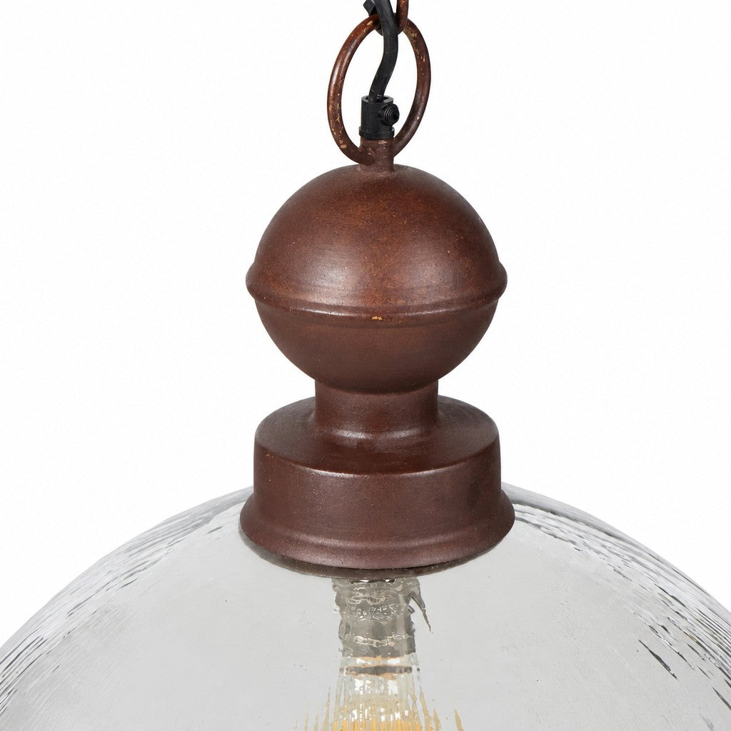 Detail of rust finished ball finial and fitter above ribbed glass shade rim