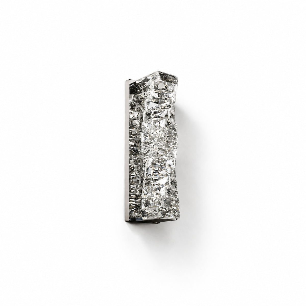 Unlit crystal block wall sconce with polished chrome backplate on plain white studio background
