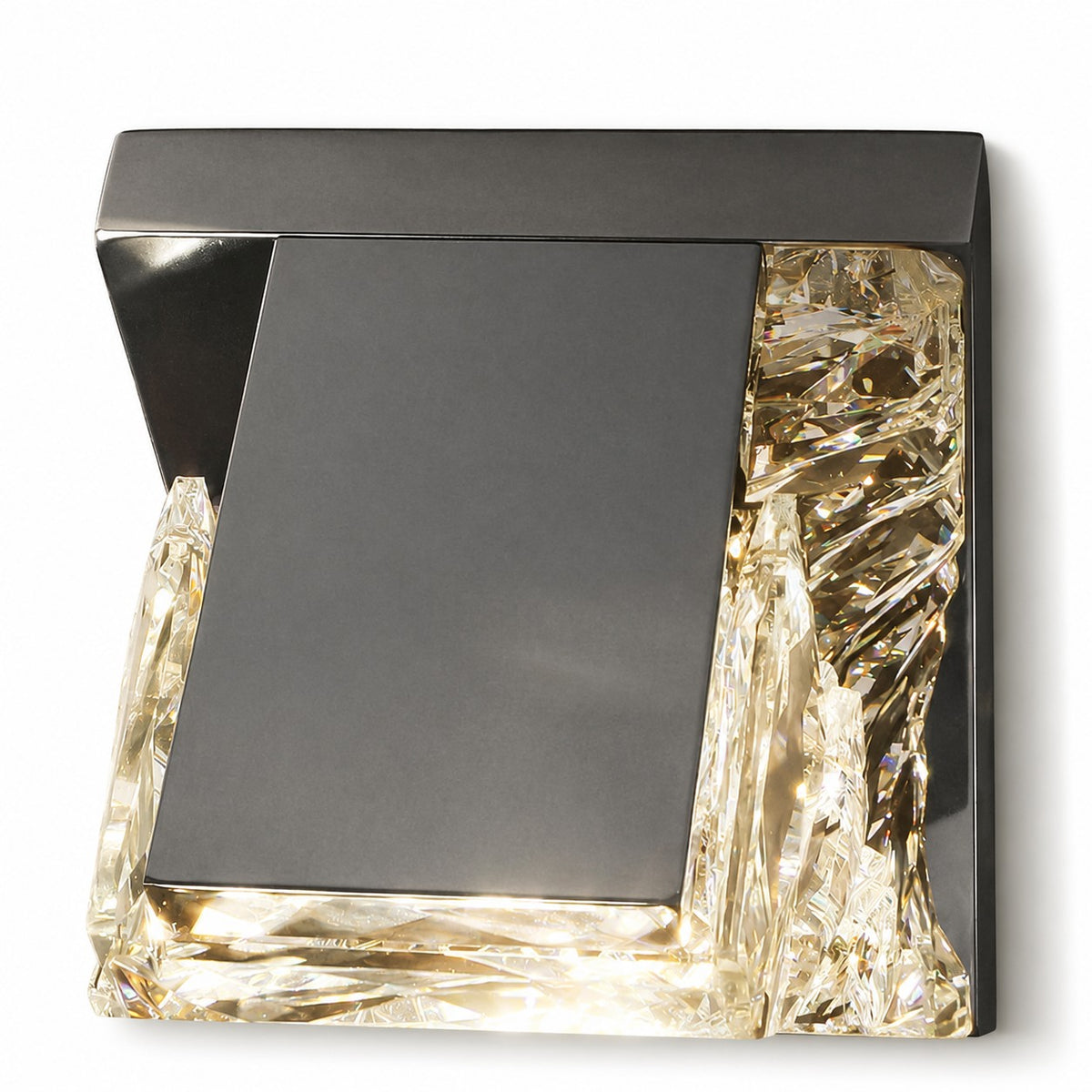 Angled overhead view of compact square sconce, dark gunmetal plate framed by lit crystal