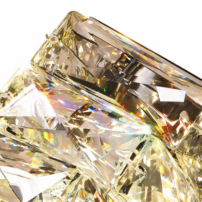 Macro detail of champagne-toned crystal facets with prismatic rainbow flares against white