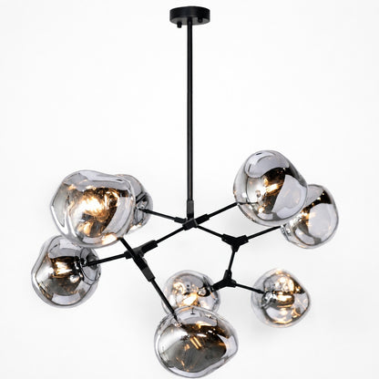 Matte black branching pendant with reflective smoked acrylic globe shades, illuminated angled view
