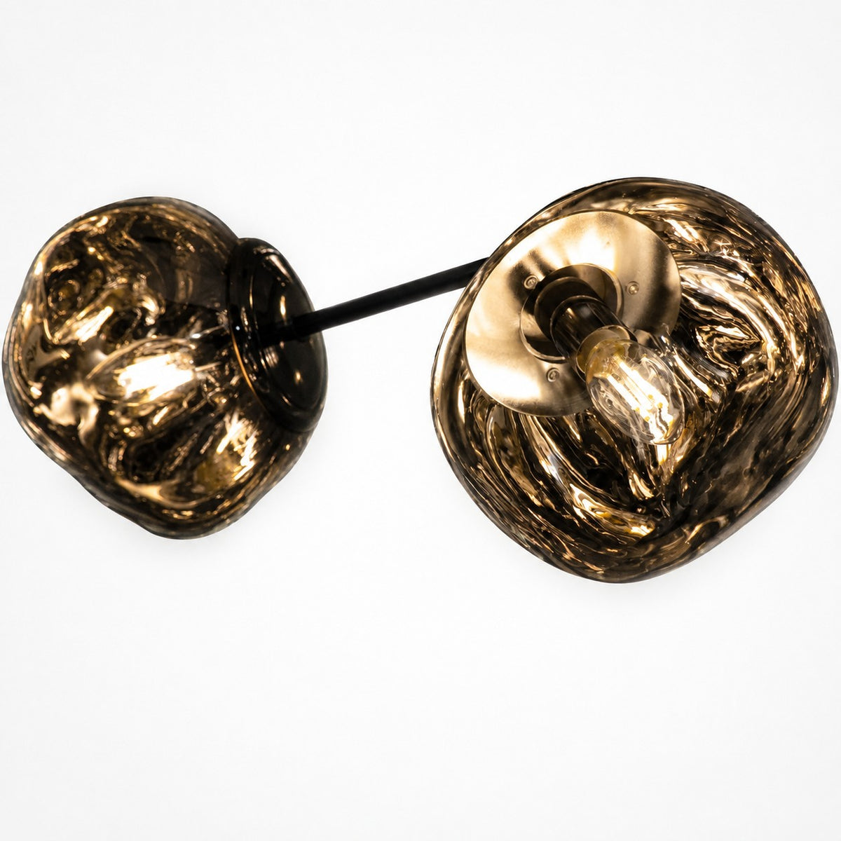 Underside detail of smoked acrylic globe shades showing bulbs and metal fittings