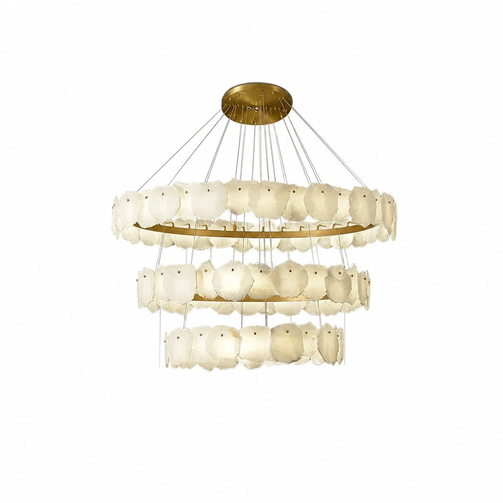Three stacked rings of translucent ivory stone panels hung from thin cables, studio white backdrop