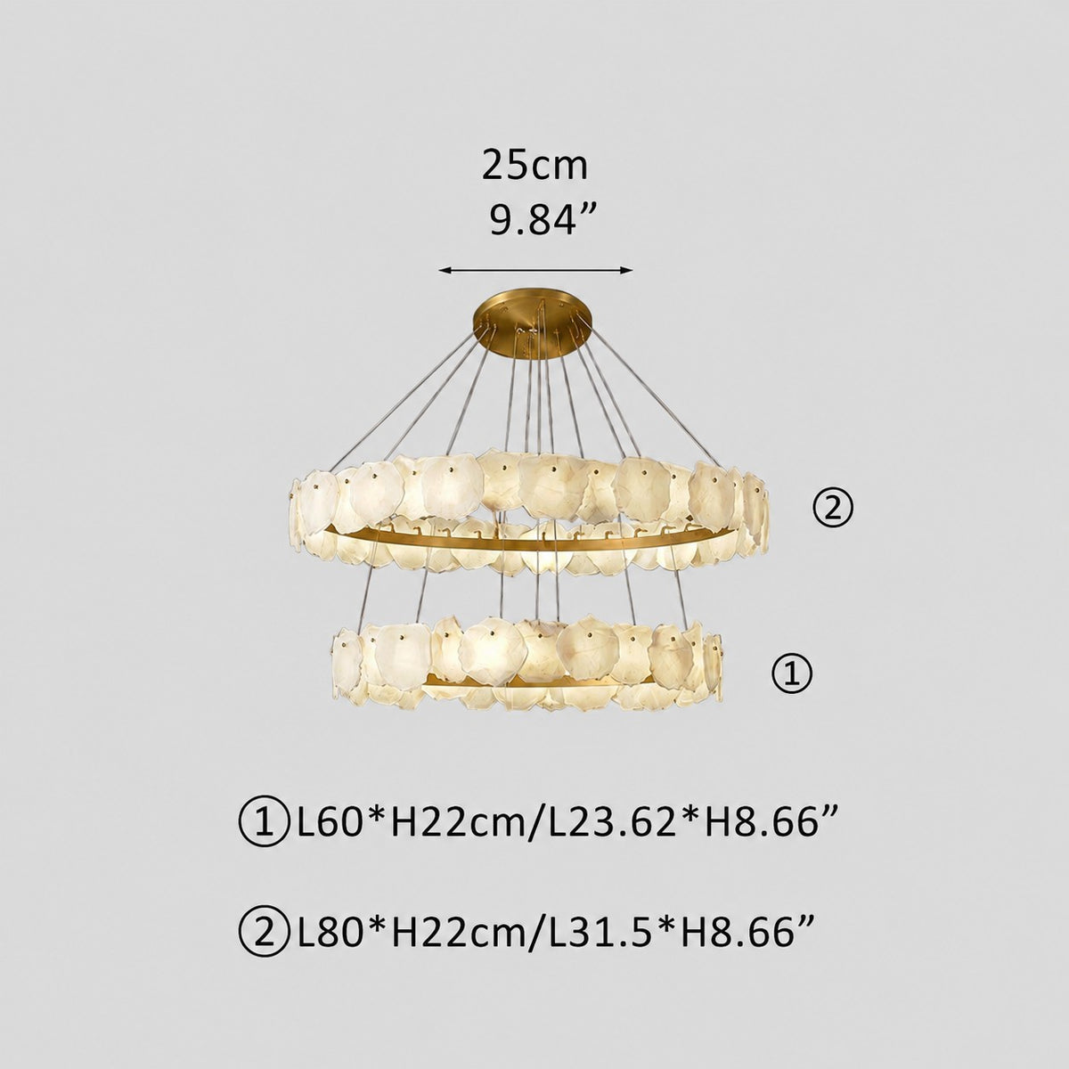 Illuminated two-tier stone chandelier casting warm glow, measurement annotations, grey studio background