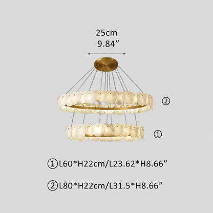Illuminated two-tier stone chandelier casting warm glow, measurement annotations, grey studio background